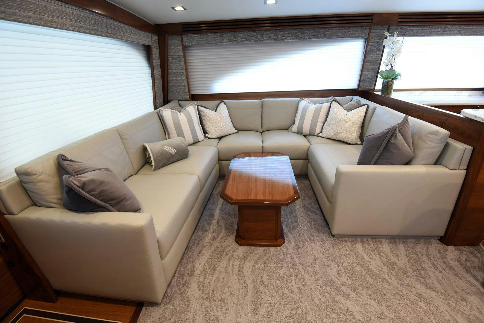a living room with a couch and a coffee table aboard AMANDA P Yacht for Sale