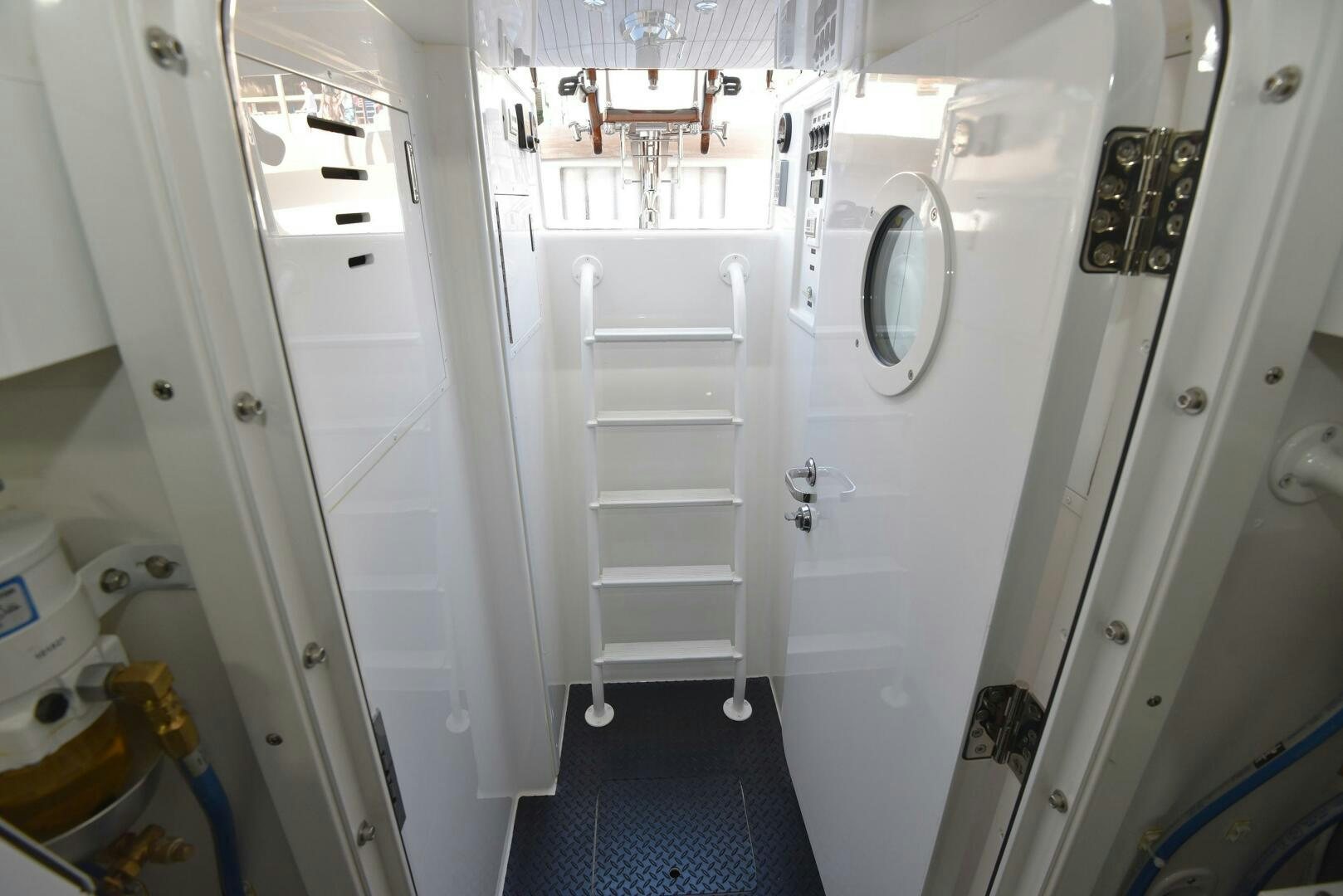 a white room with a white shelf aboard AMANDA P Yacht for Sale