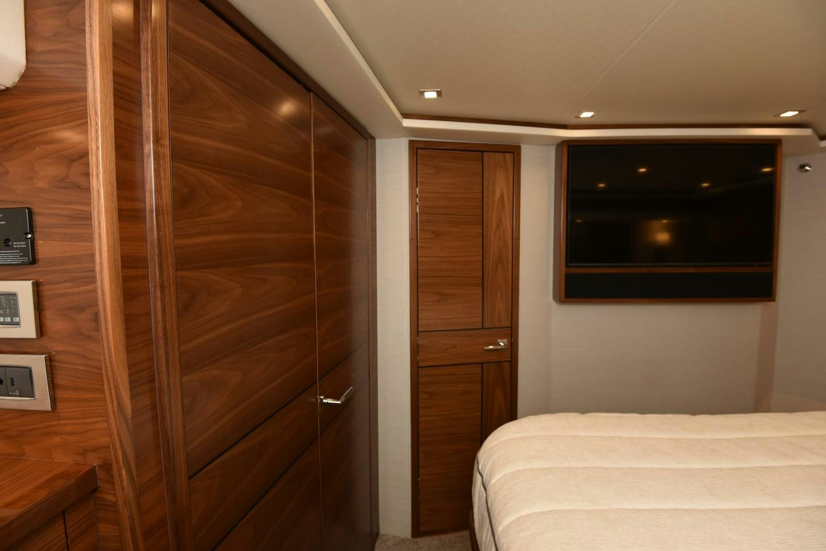 a room with a bed and a television aboard AMANDA P Yacht for Sale