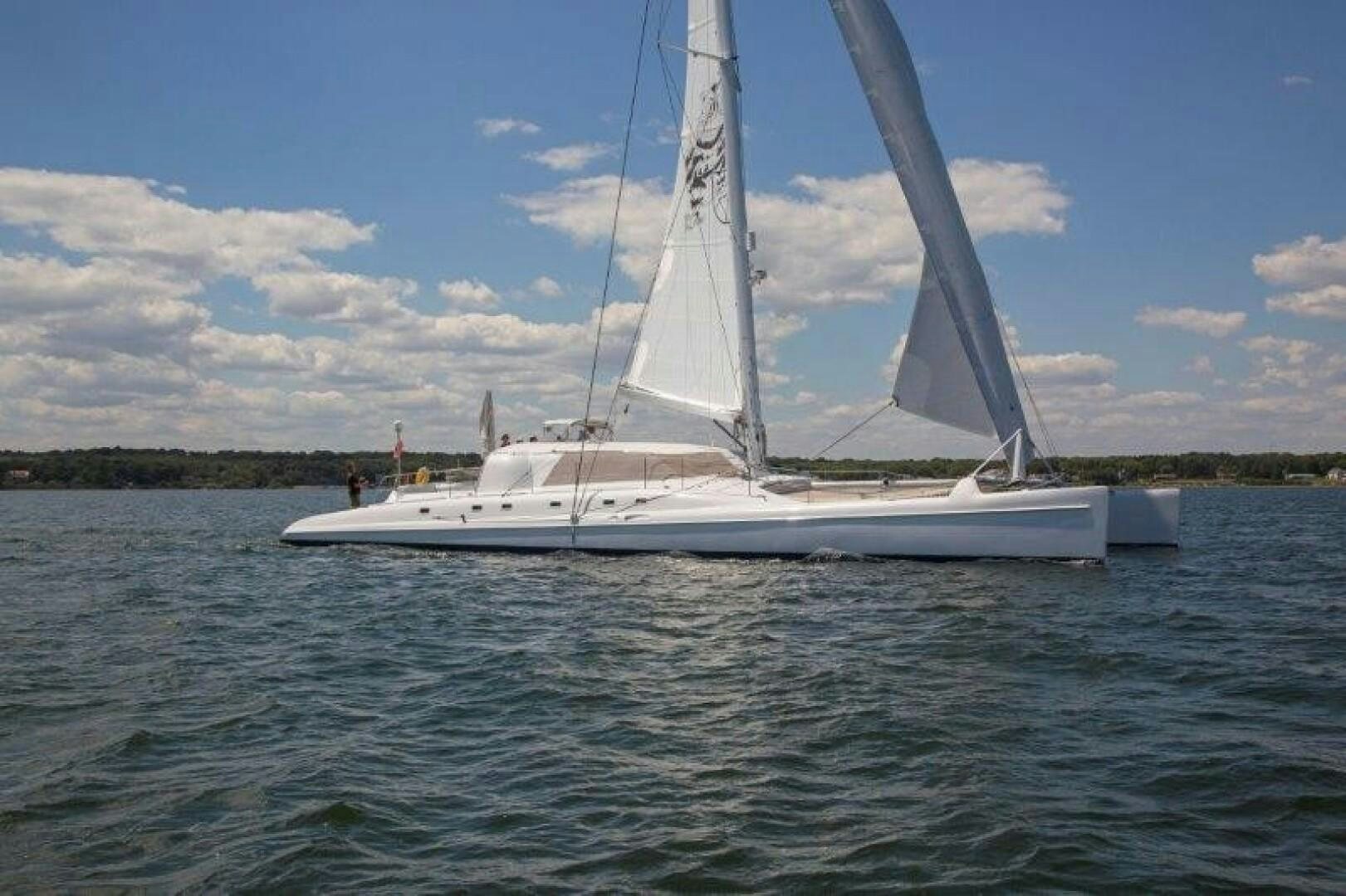 a sailboat on the water aboard FAT CAT Yacht for Sale