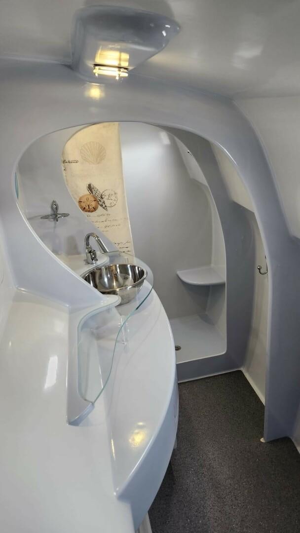 a bathroom with a sink and a toilet aboard FAT CAT Yacht for Sale