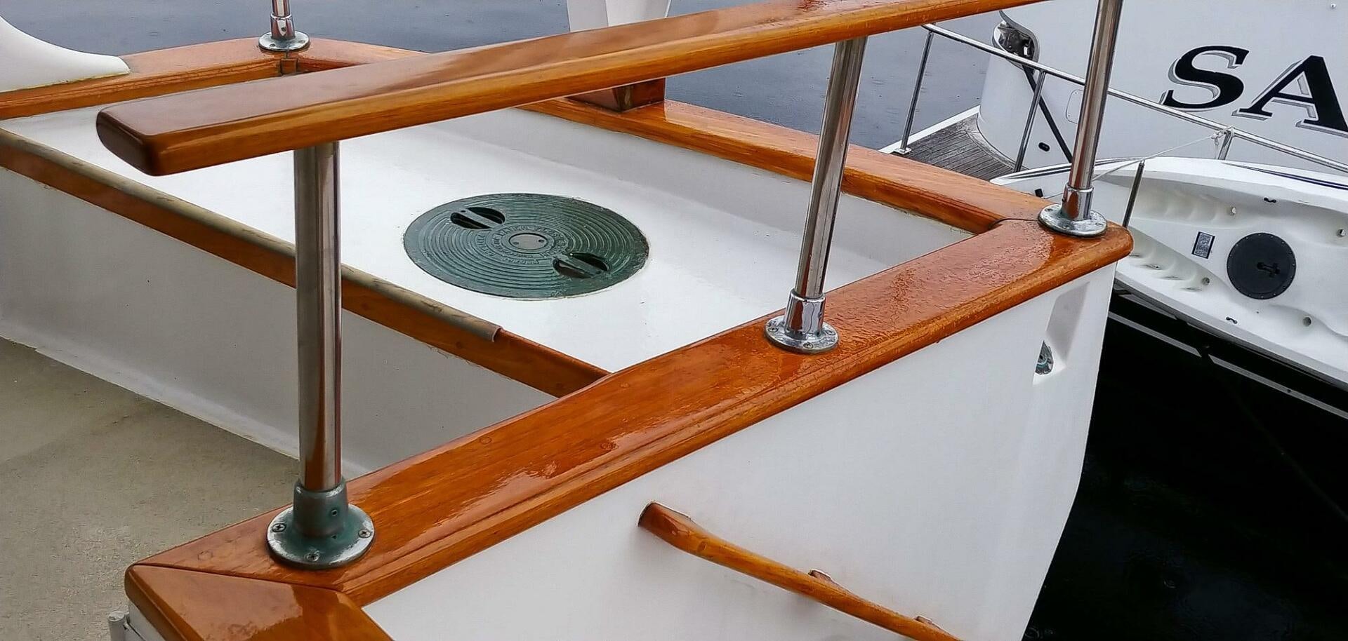 a wooden table with a metal bar aboard PIONEER Yacht for Sale