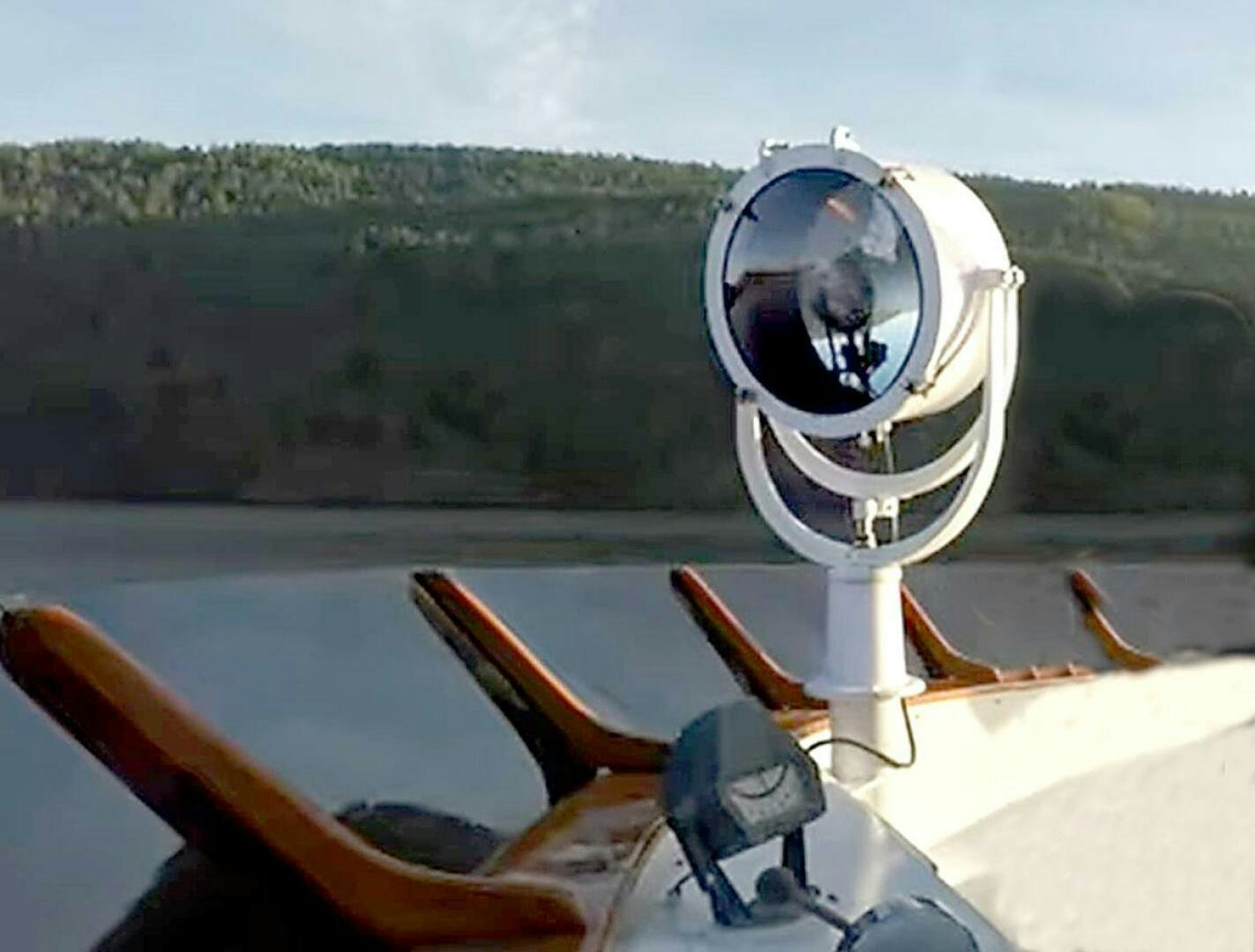 a white and black robot on a boat aboard PIONEER Yacht for Sale