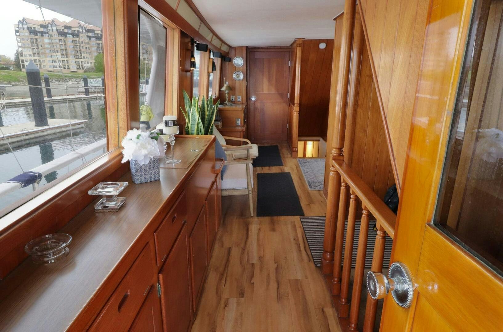 a kitchen with wooden cabinets aboard PIONEER Yacht for Sale
