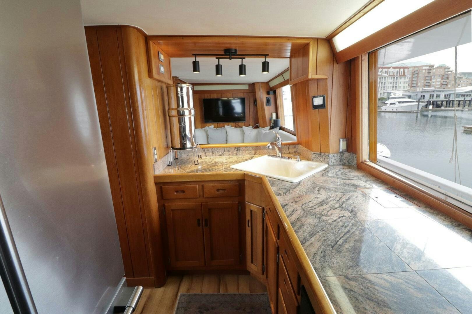 a kitchen with a marble counter top aboard PIONEER Yacht for Sale