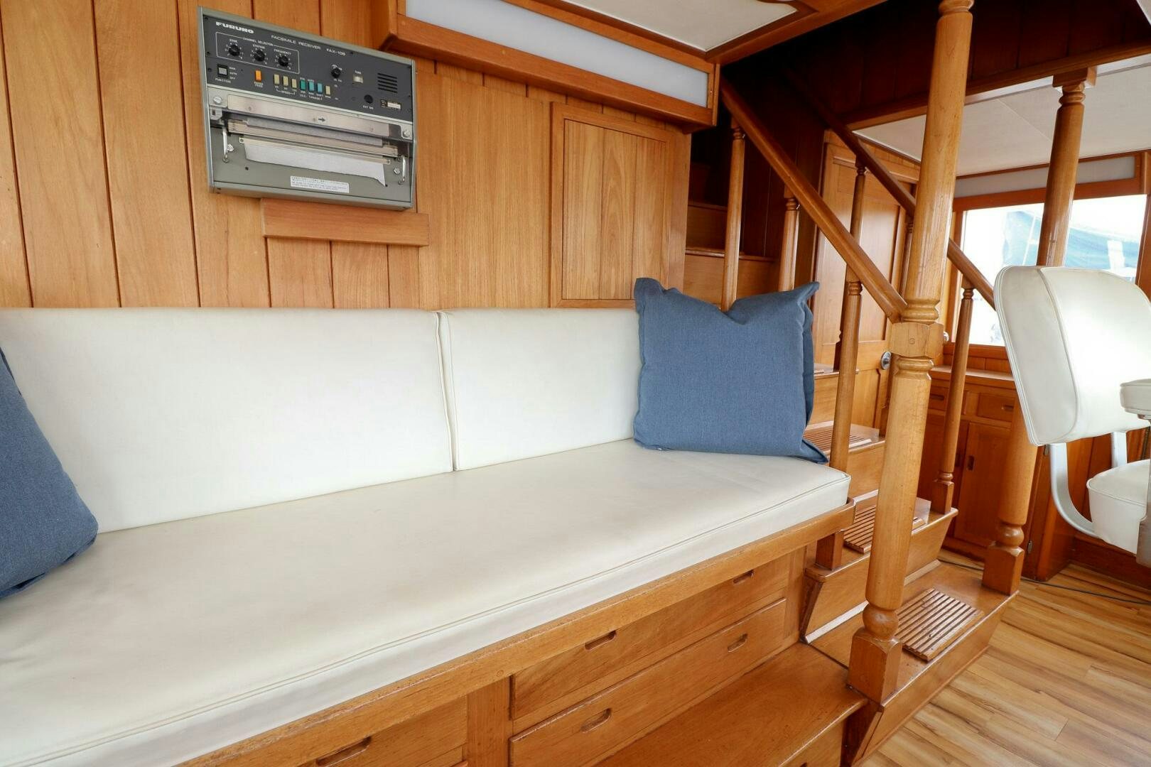 a couch in a room aboard PIONEER Yacht for Sale