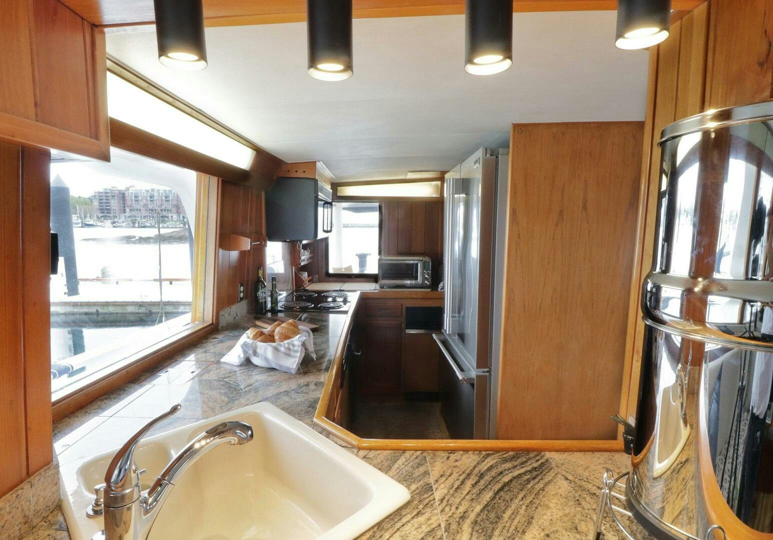a large bathroom with a large window aboard PIONEER Yacht for Sale
