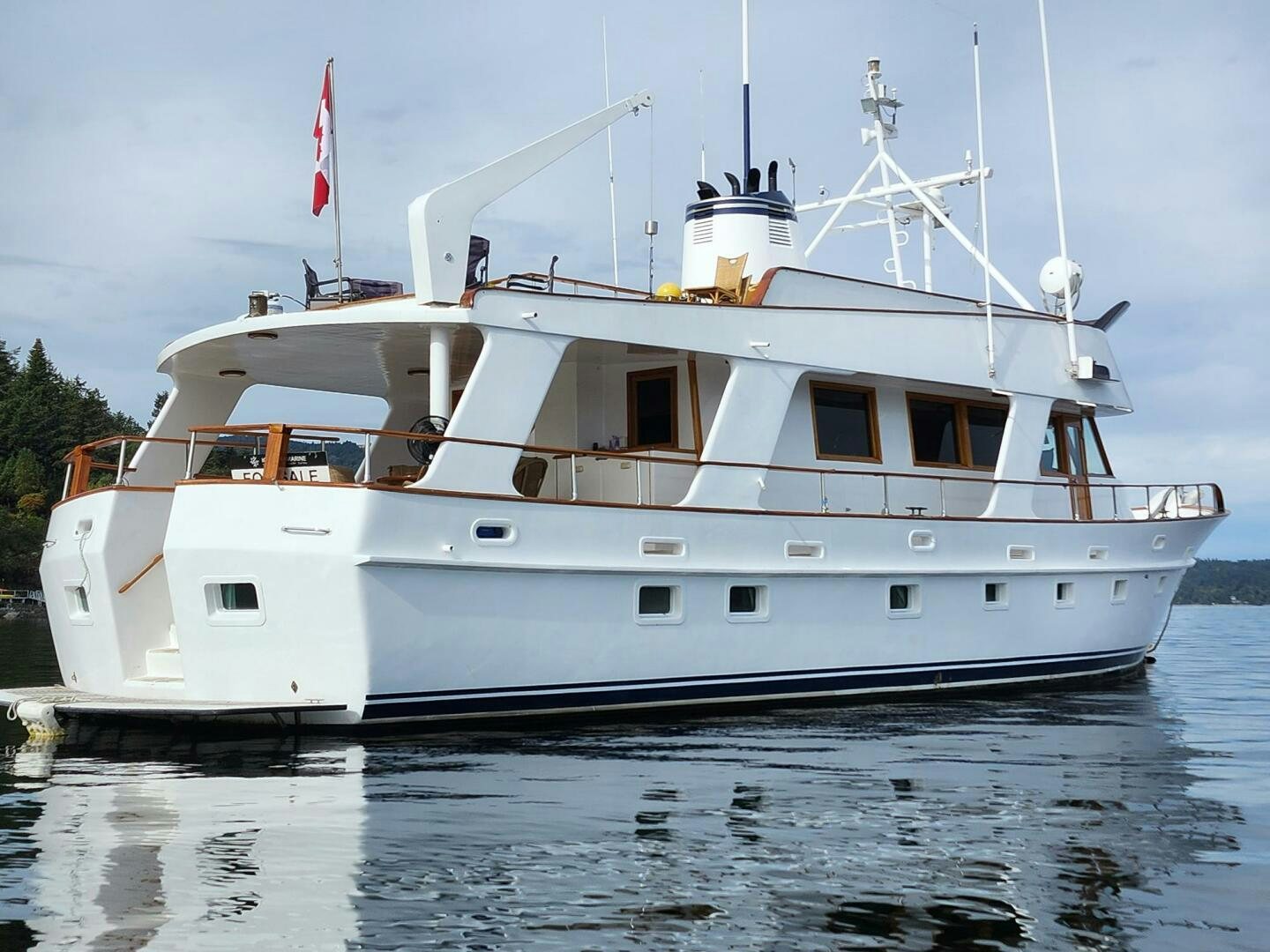 a white boat on the water aboard PIONEER Yacht for Sale