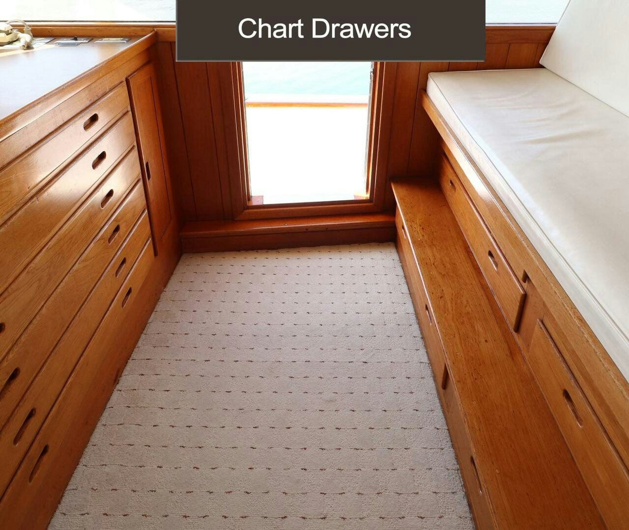 a room with a bed and a window aboard PIONEER Yacht for Sale