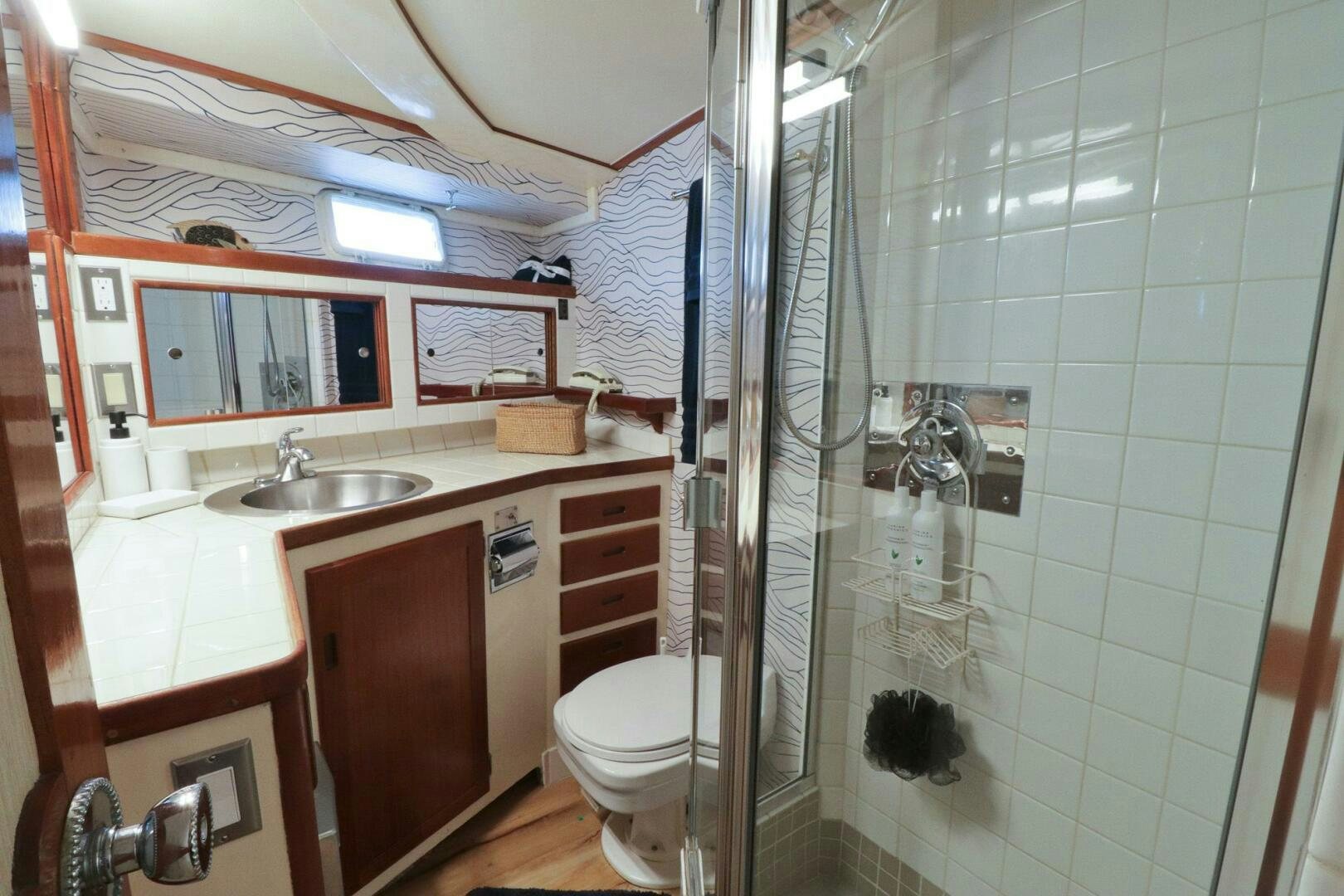 a bathroom with a sink and toilet aboard PIONEER Yacht for Sale