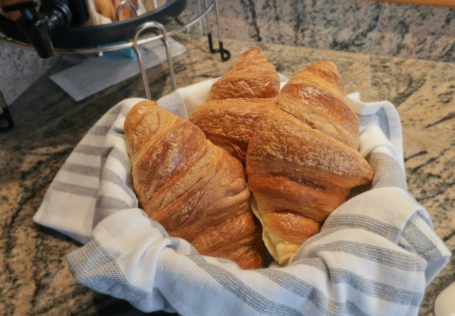 a pair of hands holding a loaf of bread aboard PIONEER Yacht for Sale
