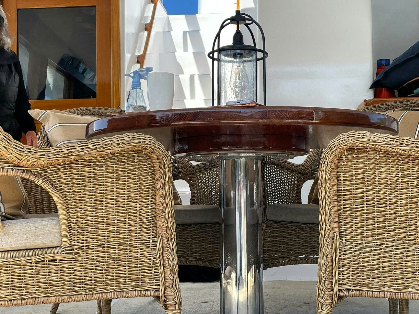 a table with chairs and a basket aboard PIONEER Yacht for Sale