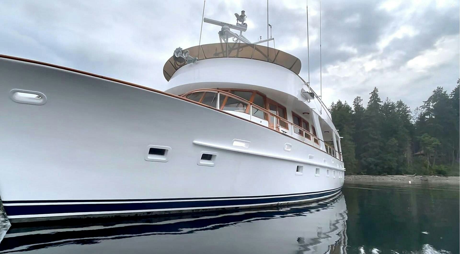 a white yacht on the water aboard PIONEER Yacht for Sale