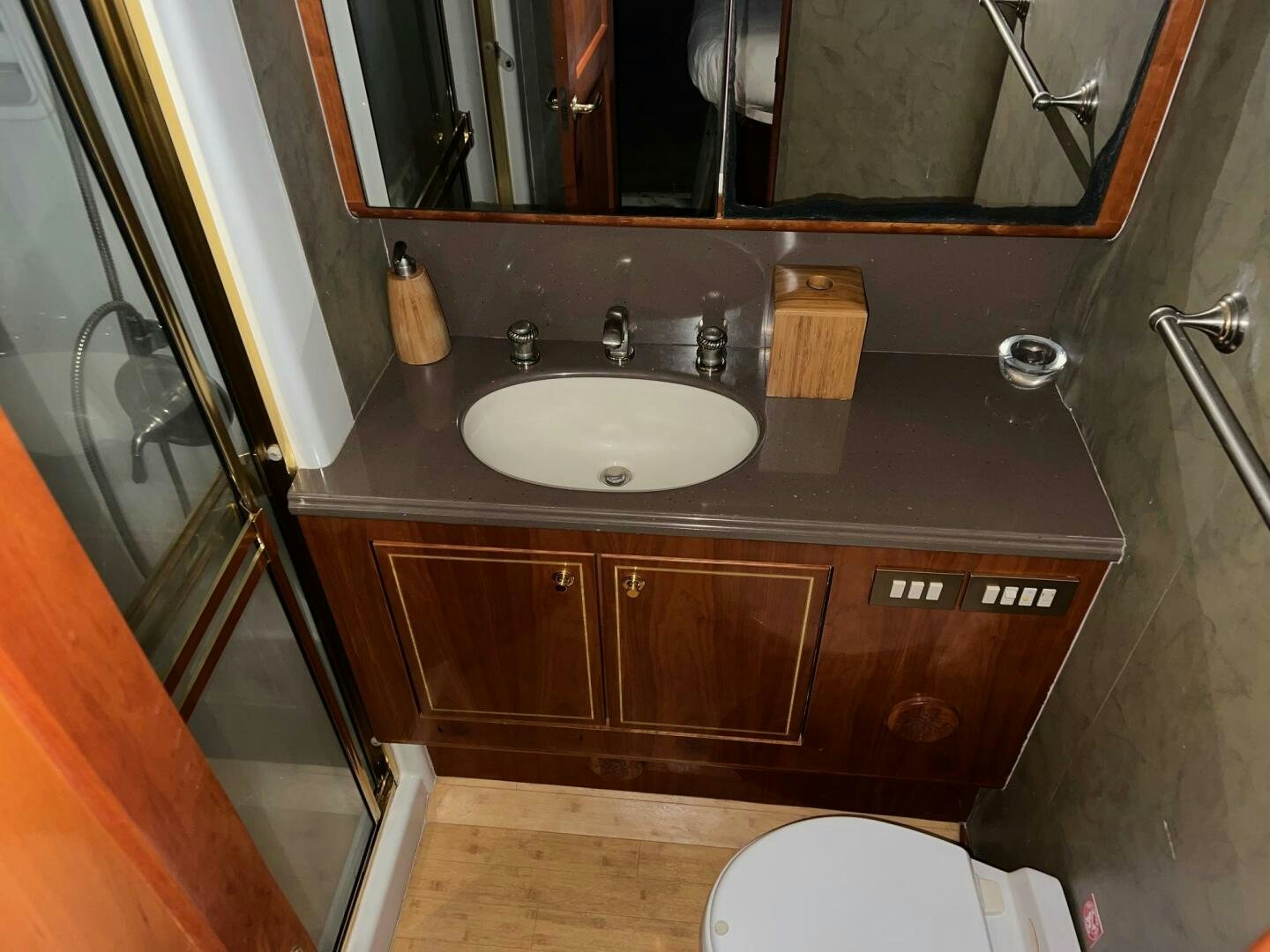 a bathroom with a sink and a mirror aboard BUCK-N-BILLS Yacht for Sale