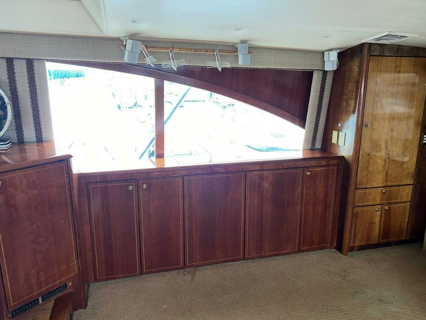 a room with wooden cabinets aboard BUCK-N-BILLS Yacht for Sale
