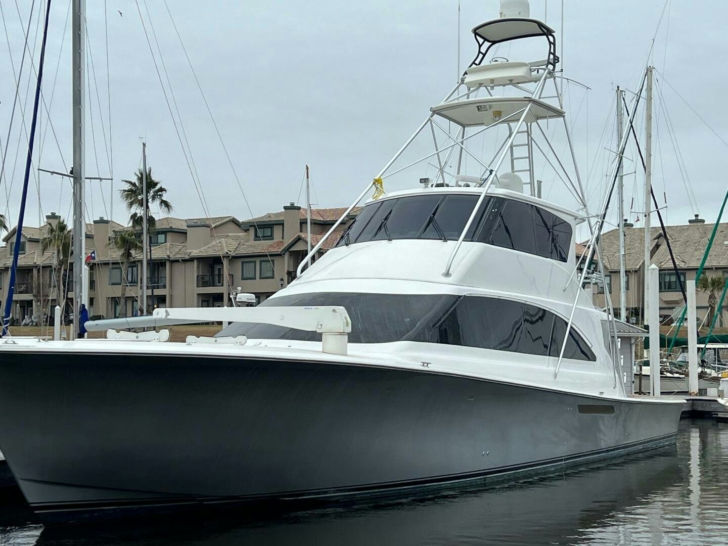 a boat docked in a harbor aboard BUCK-N-BILLS Yacht for Sale