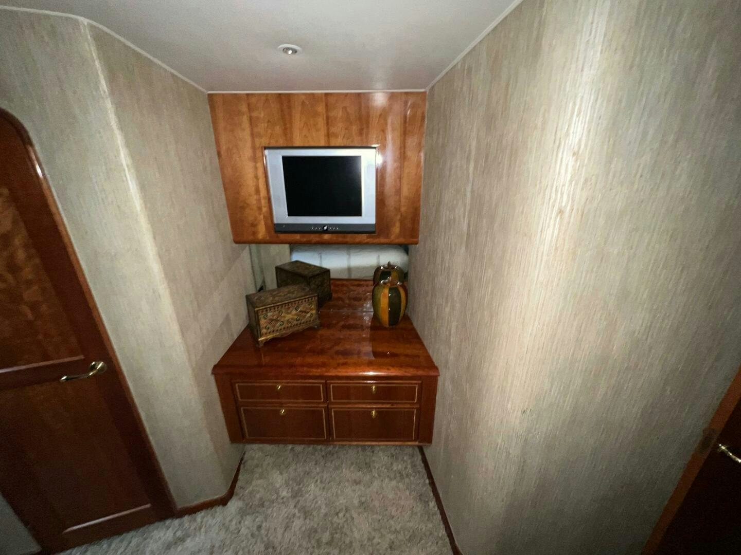 a tv on a wooden wall aboard BUCK-N-BILLS Yacht for Sale