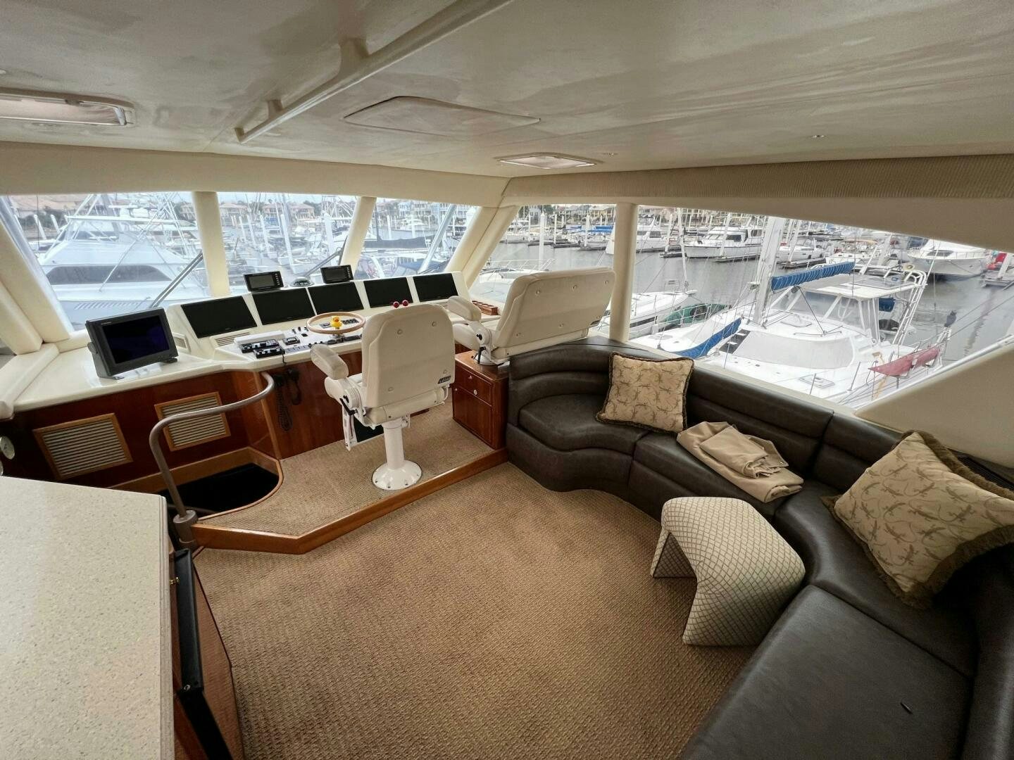 a large room with a couch and a table aboard BUCK-N-BILLS Yacht for Sale