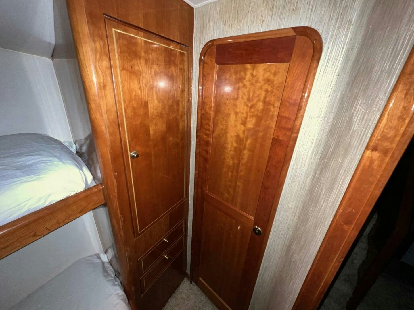 a wooden cabinet in a room aboard BUCK-N-BILLS Yacht for Sale