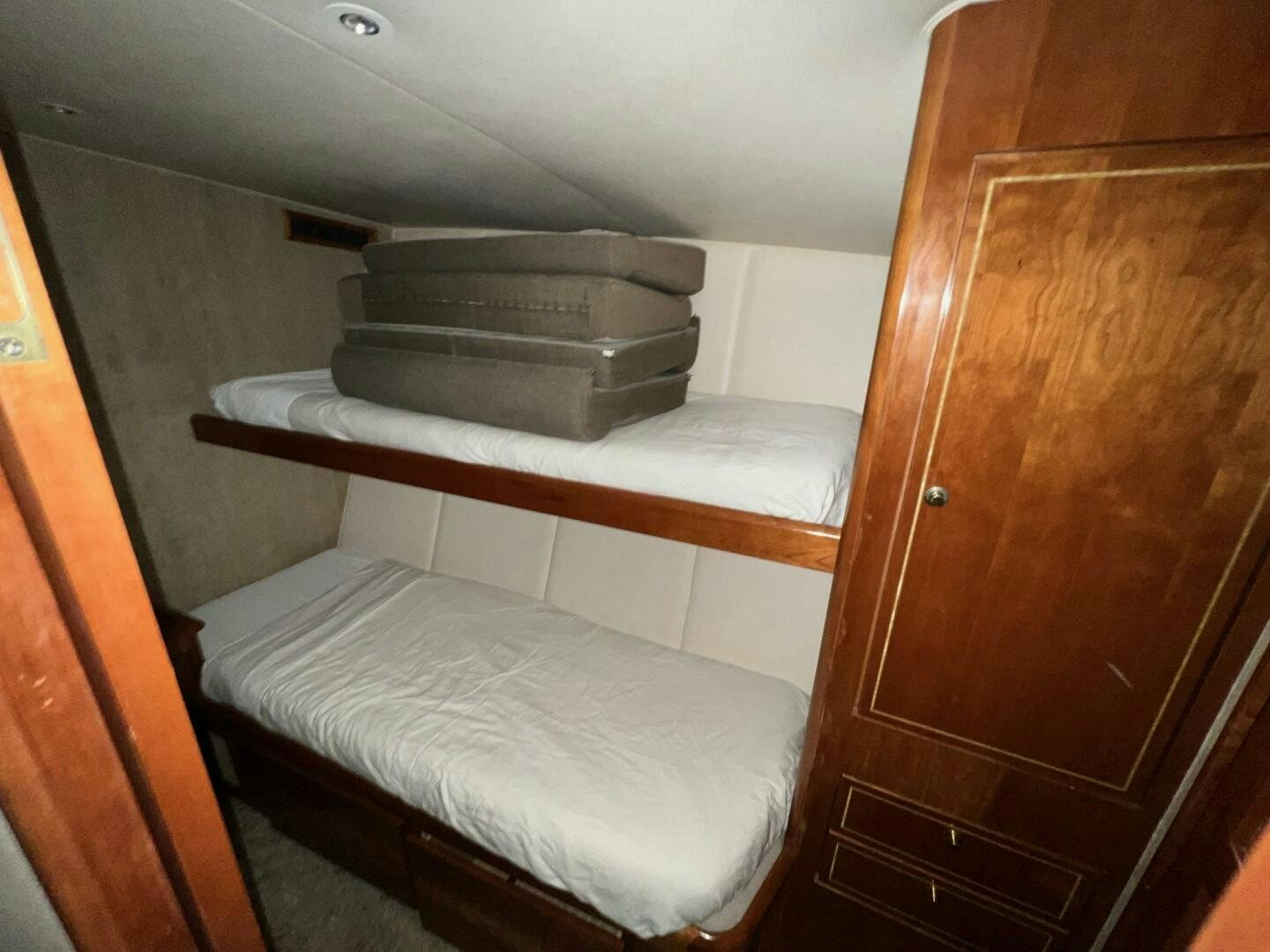 a bed with a white sheet aboard BUCK-N-BILLS Yacht for Sale