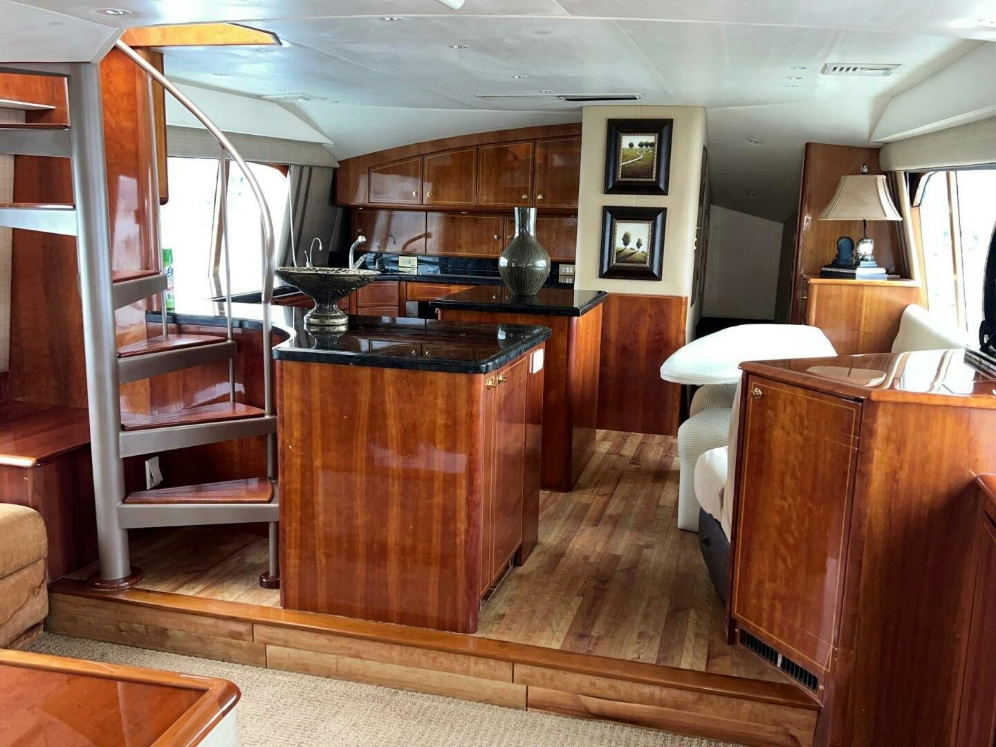 a room with a wood cabinet and a large mirror aboard BUCK-N-BILLS Yacht for Sale