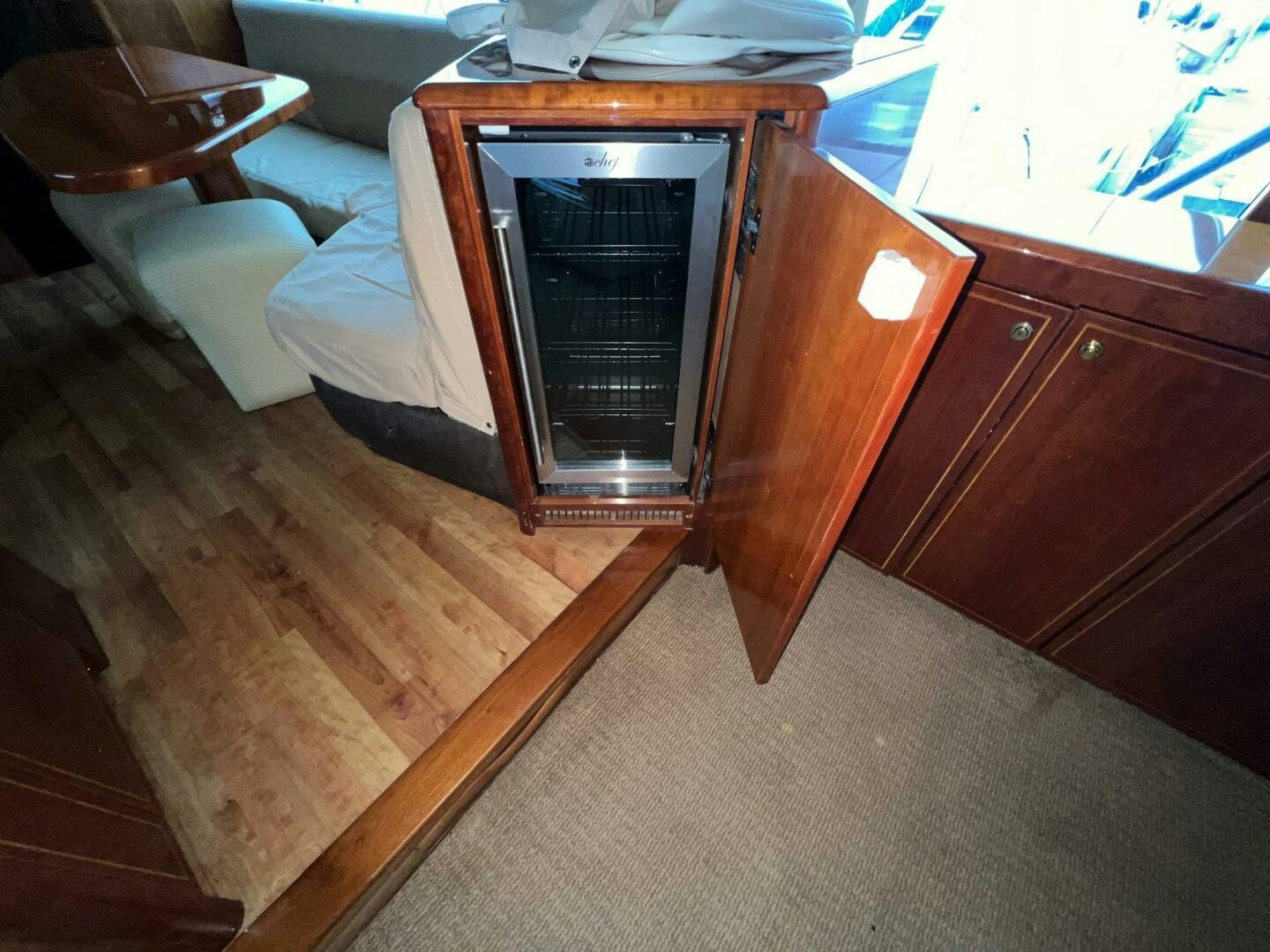 a cabinet with a glass door aboard BUCK-N-BILLS Yacht for Sale
