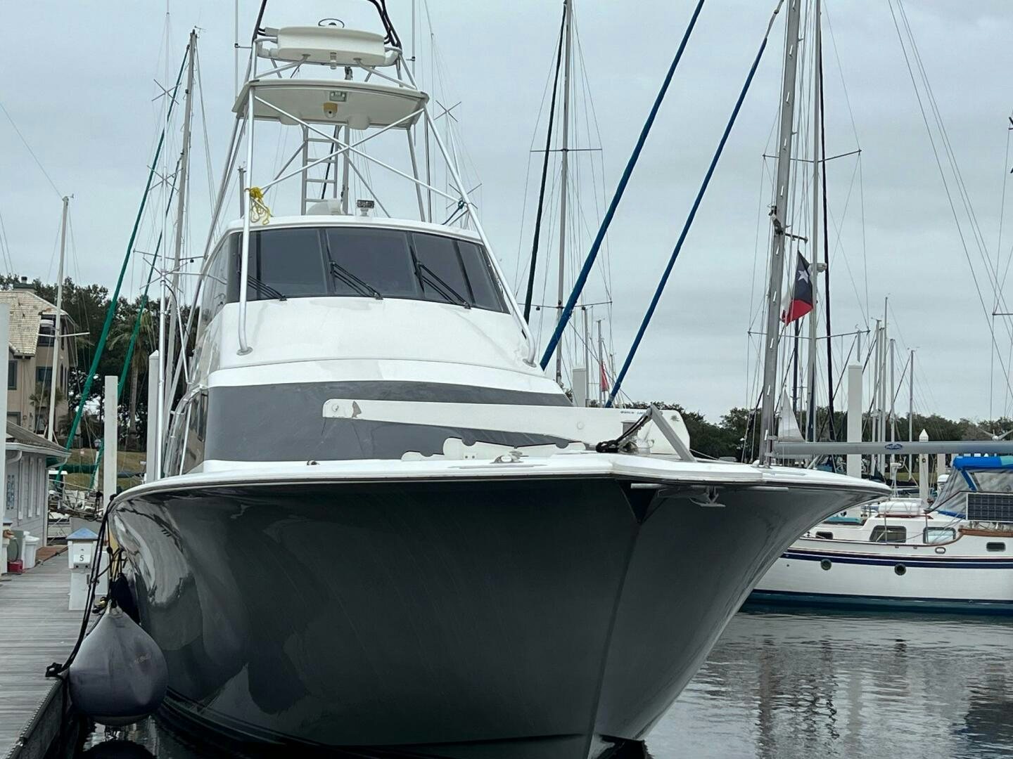 a boat docked at a pier aboard BUCK-N-BILLS Yacht for Sale