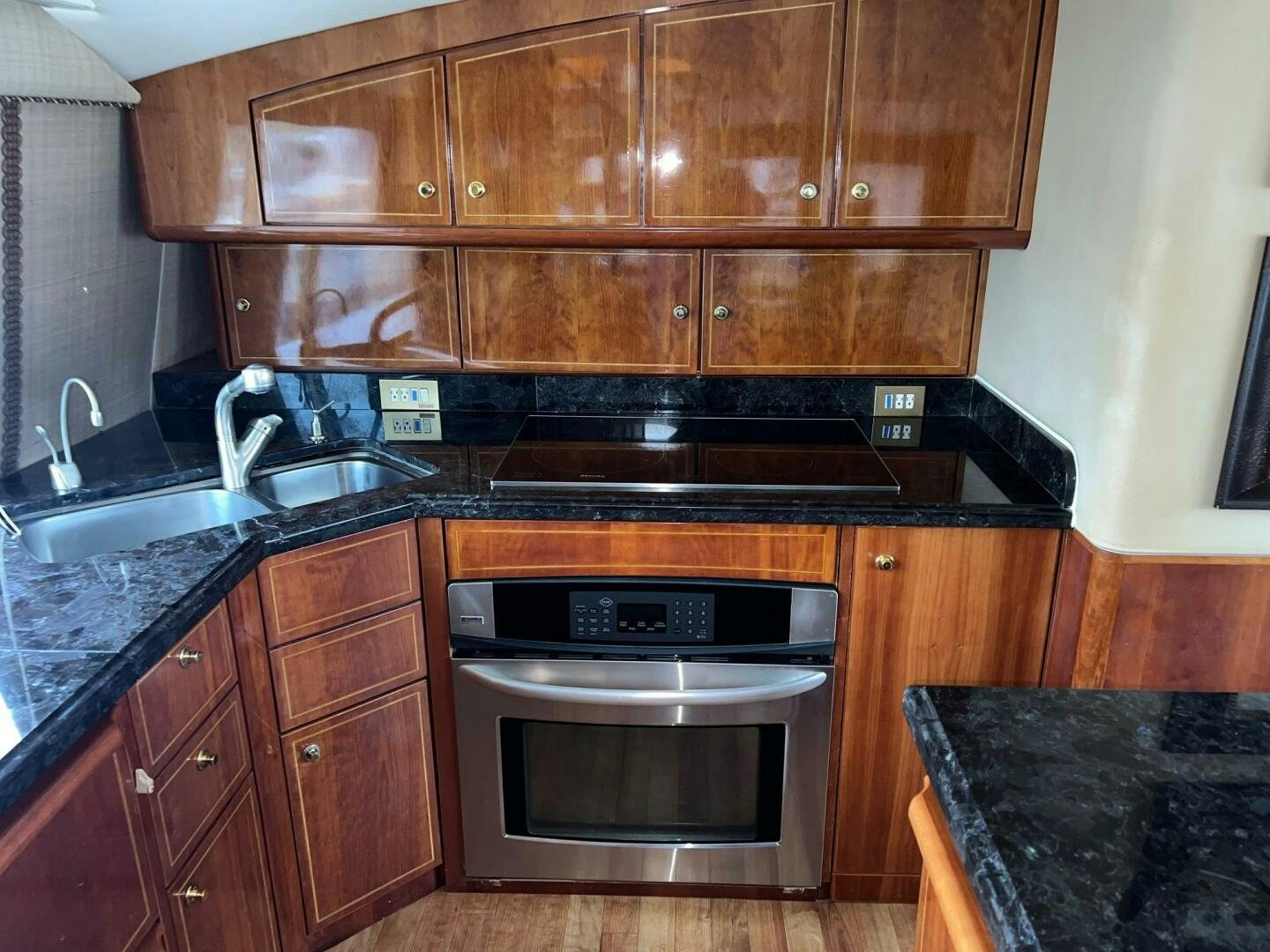a kitchen with wooden cabinets aboard BUCK-N-BILLS Yacht for Sale