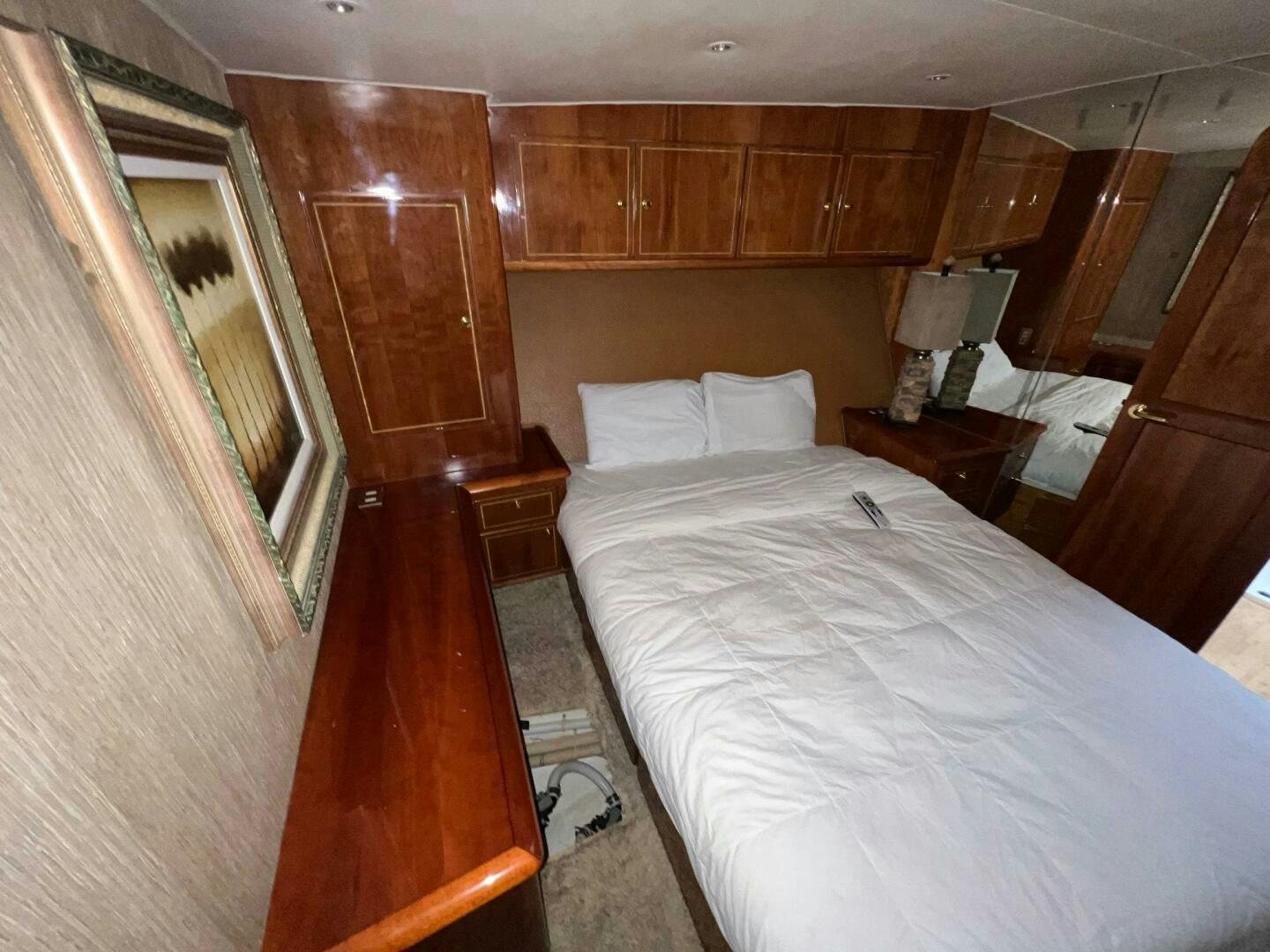 a room with a bed and a table aboard BUCK-N-BILLS Yacht for Sale