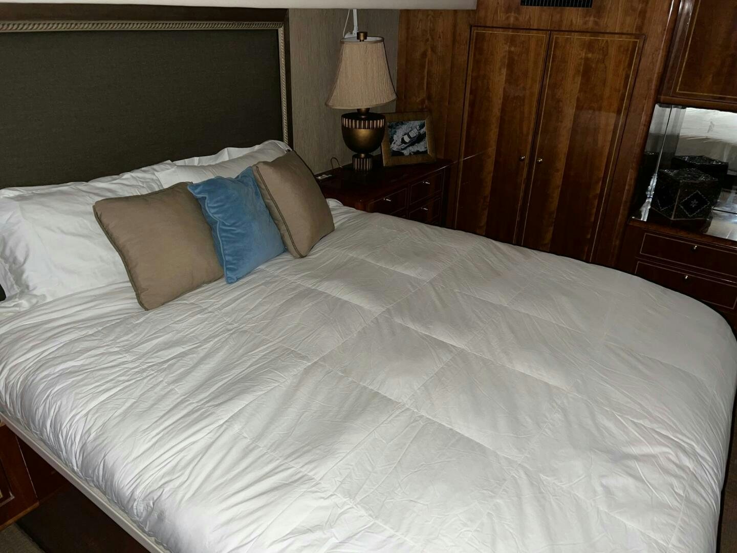 a bed with white sheets aboard BUCK-N-BILLS Yacht for Sale