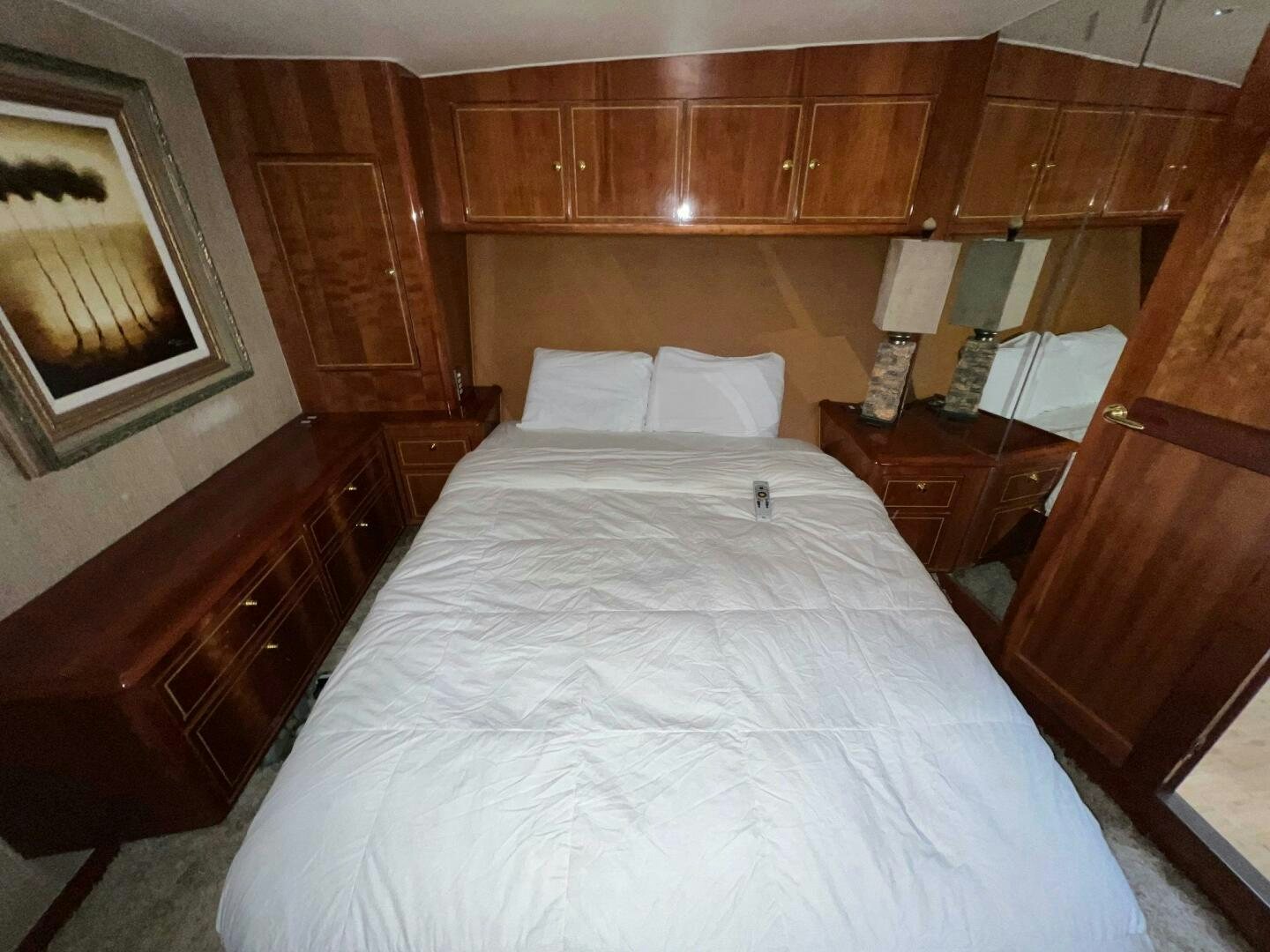 a bed with white sheets aboard BUCK-N-BILLS Yacht for Sale