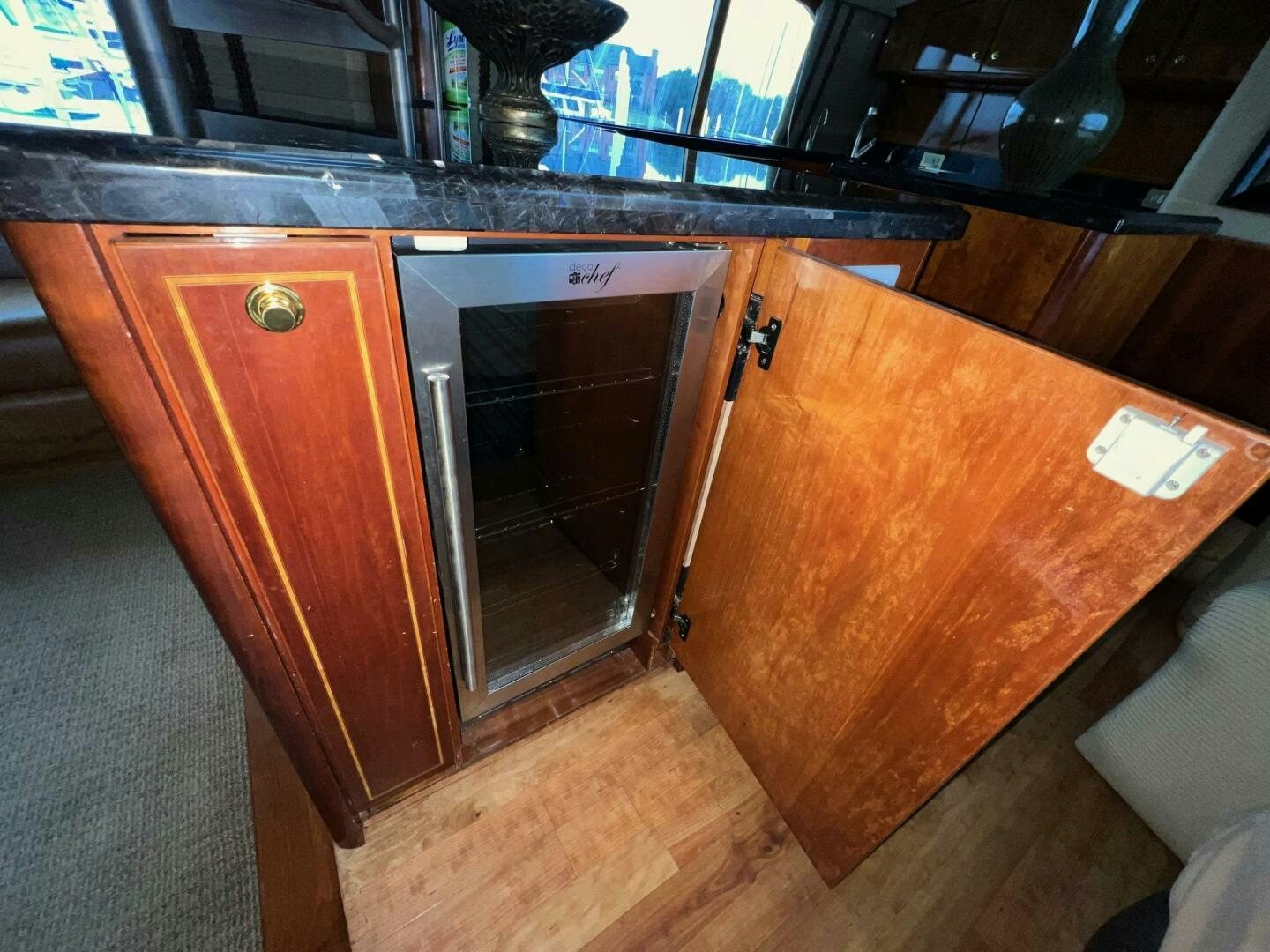 a kitchen with wooden cabinets aboard BUCK-N-BILLS Yacht for Sale
