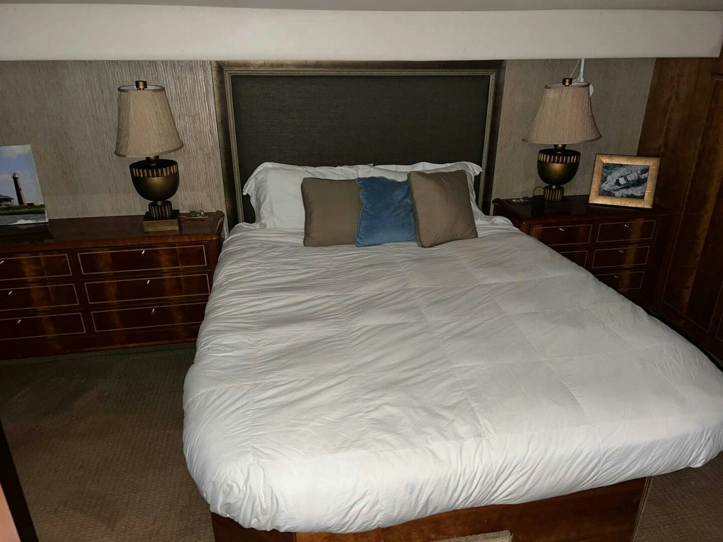 a bed with white sheets aboard BUCK-N-BILLS Yacht for Sale