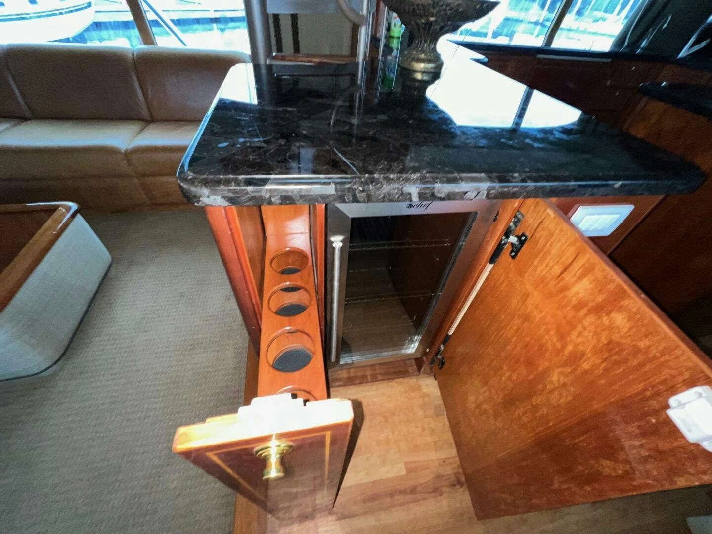 a wood table with a glass top aboard BUCK-N-BILLS Yacht for Sale