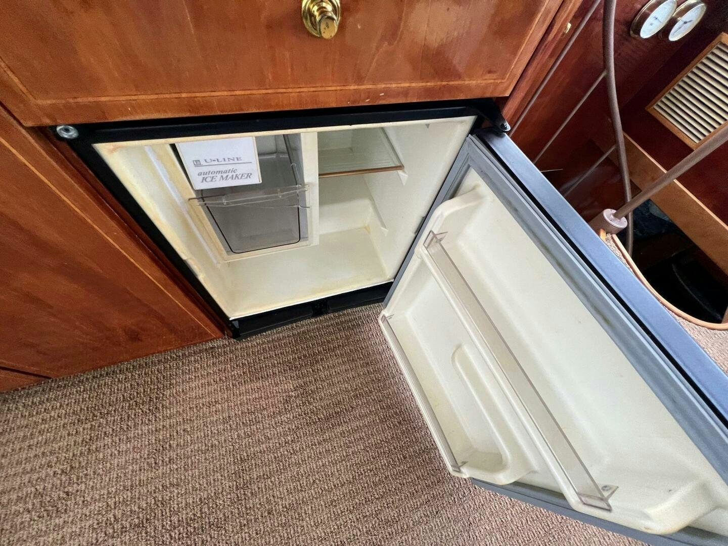 a white cabinet with drawers aboard BUCK-N-BILLS Yacht for Sale