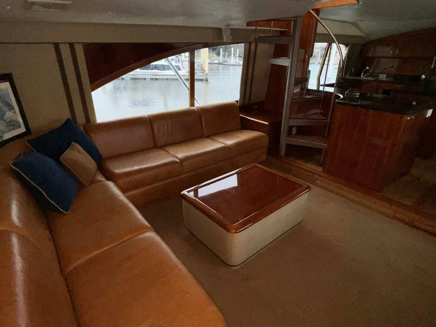 a living room with a couch and a window aboard BUCK-N-BILLS Yacht for Sale
