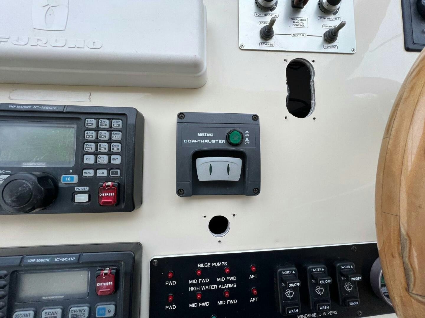 a person's hand holding a phone with a keypad and buttons aboard BUCK-N-BILLS Yacht for Sale