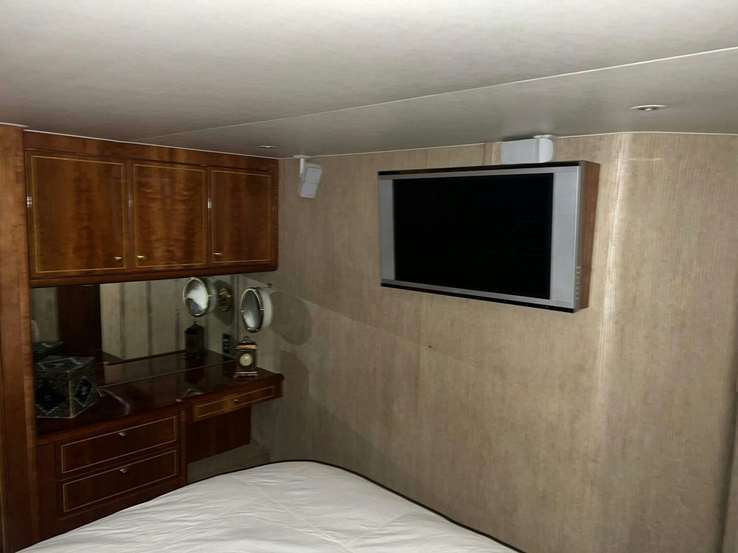 a small bedroom with a tv aboard BUCK-N-BILLS Yacht for Sale