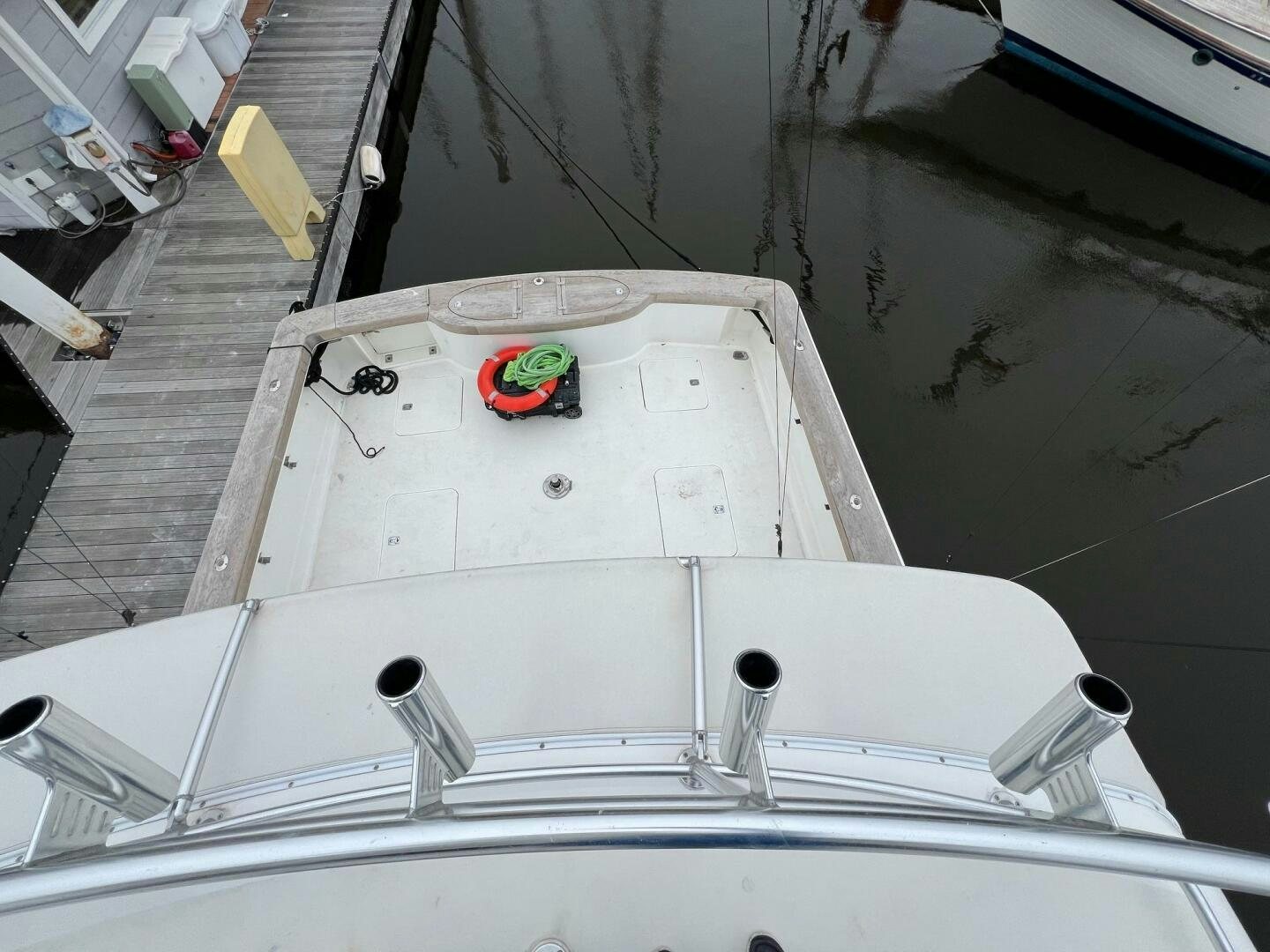 a white boat with a red and green object on it aboard BUCK-N-BILLS Yacht for Sale