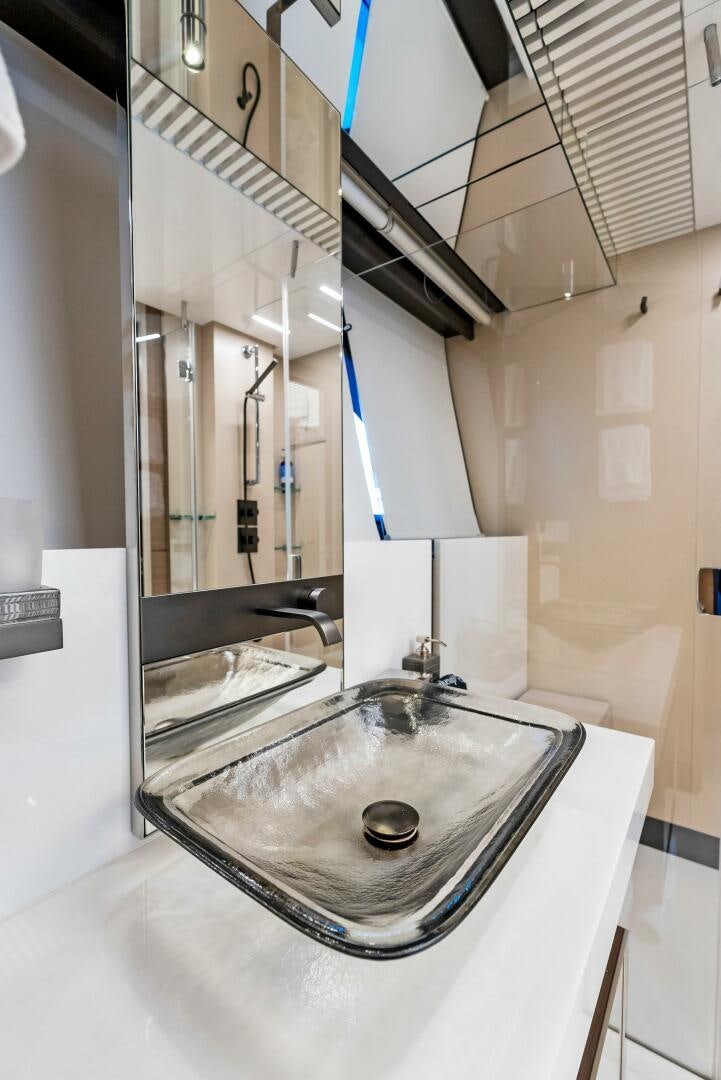 a bathroom with a sink and a mirror aboard SILHOUETTE Yacht for Sale