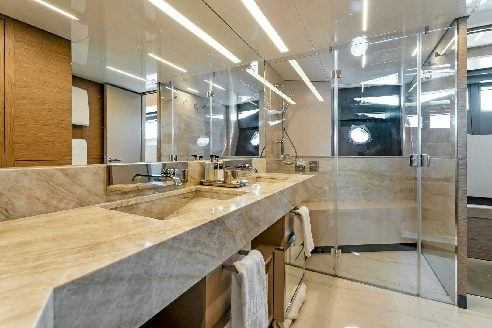 a bathroom with a countertop sink and a shower aboard SILHOUETTE Yacht for Sale