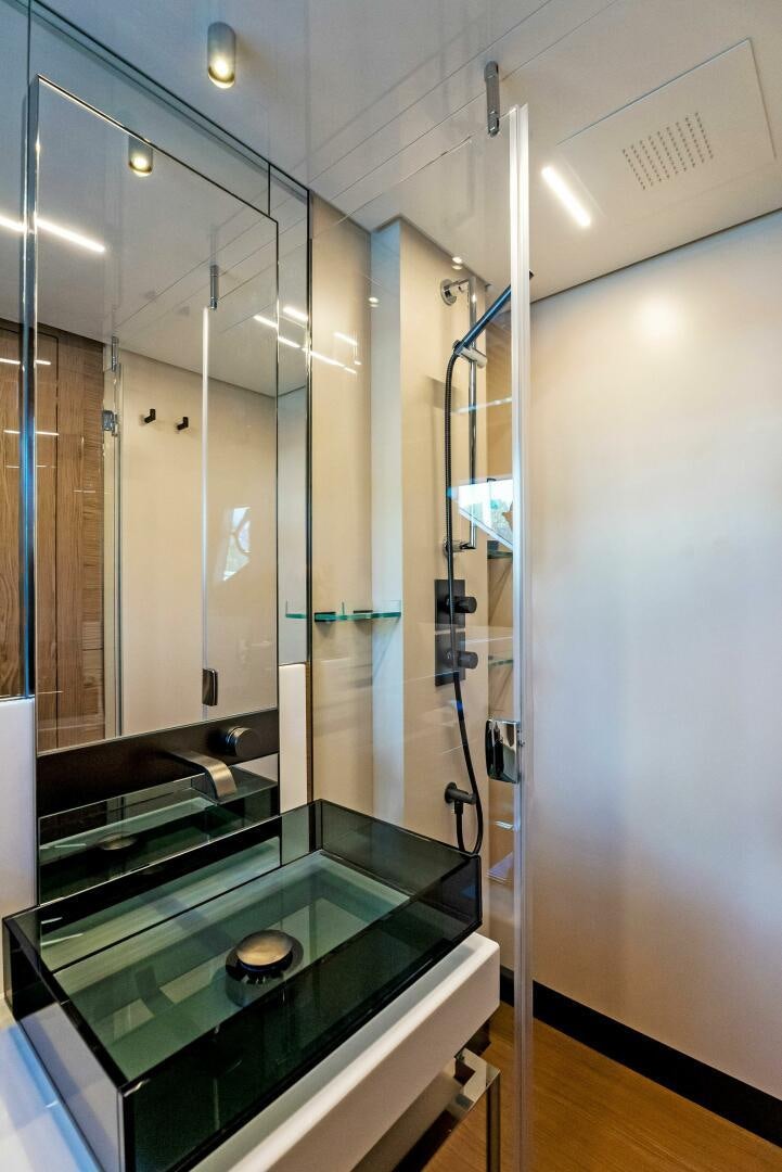 a bathroom with a glass shower aboard SILHOUETTE Yacht for Sale