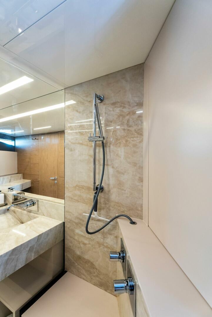 a bathroom with a shower and sink aboard SILHOUETTE Yacht for Sale