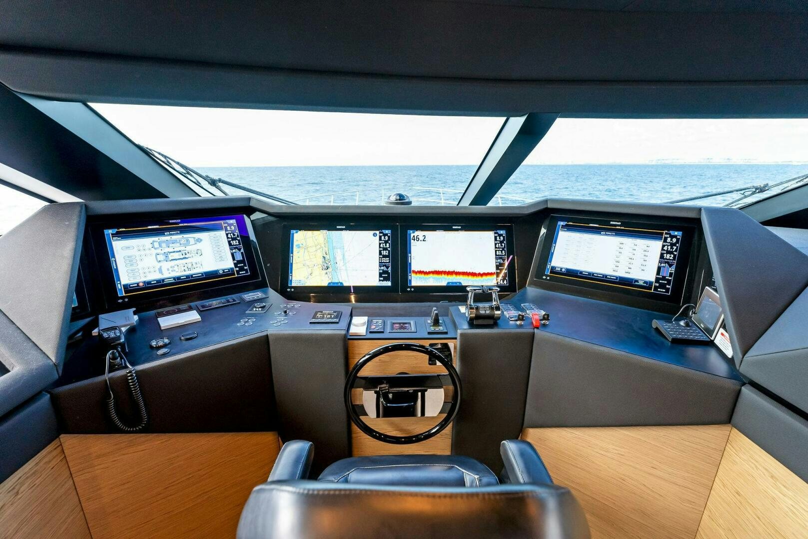 a desk with computers and other electronic devices on it aboard SILHOUETTE Yacht for Sale