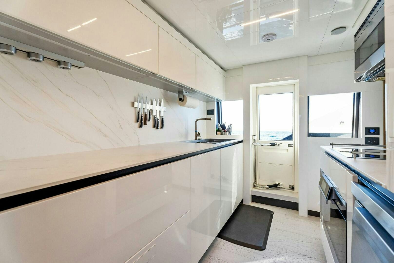 a kitchen with a sink and cabinets aboard SILHOUETTE Yacht for Sale