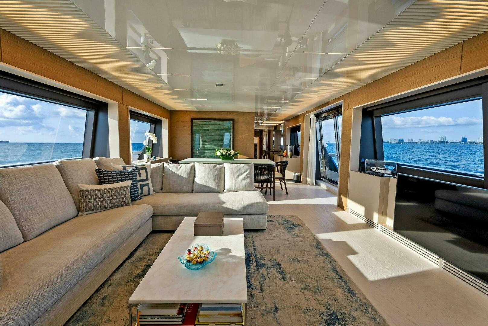 a living room with a large screen aboard SILHOUETTE Yacht for Sale