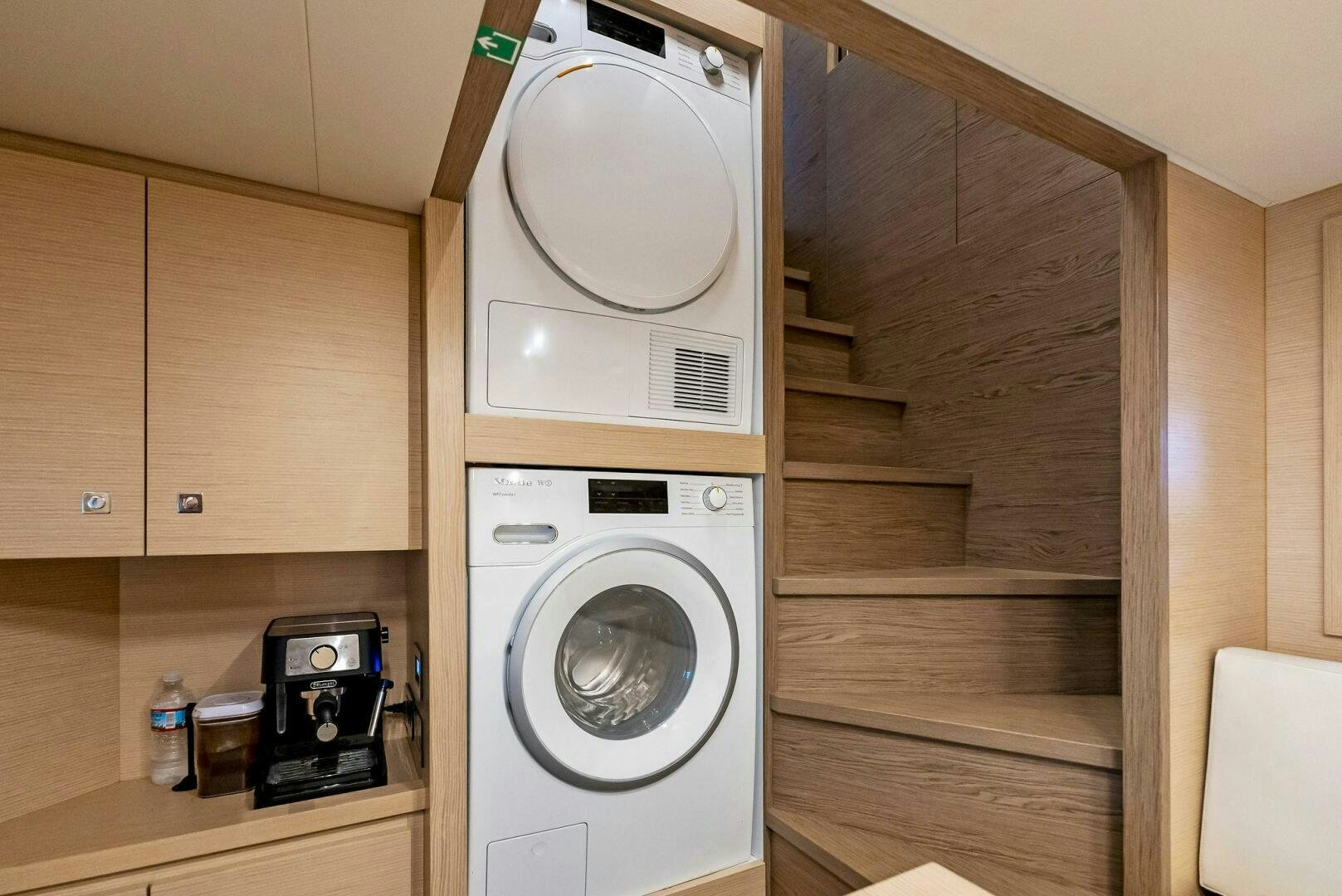 a white washing machine and a microwave aboard SILHOUETTE Yacht for Sale