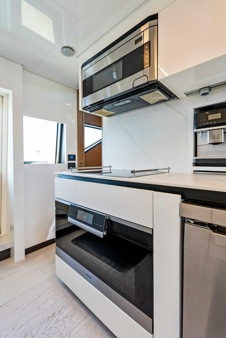 a kitchen with a stove and oven aboard SILHOUETTE Yacht for Sale