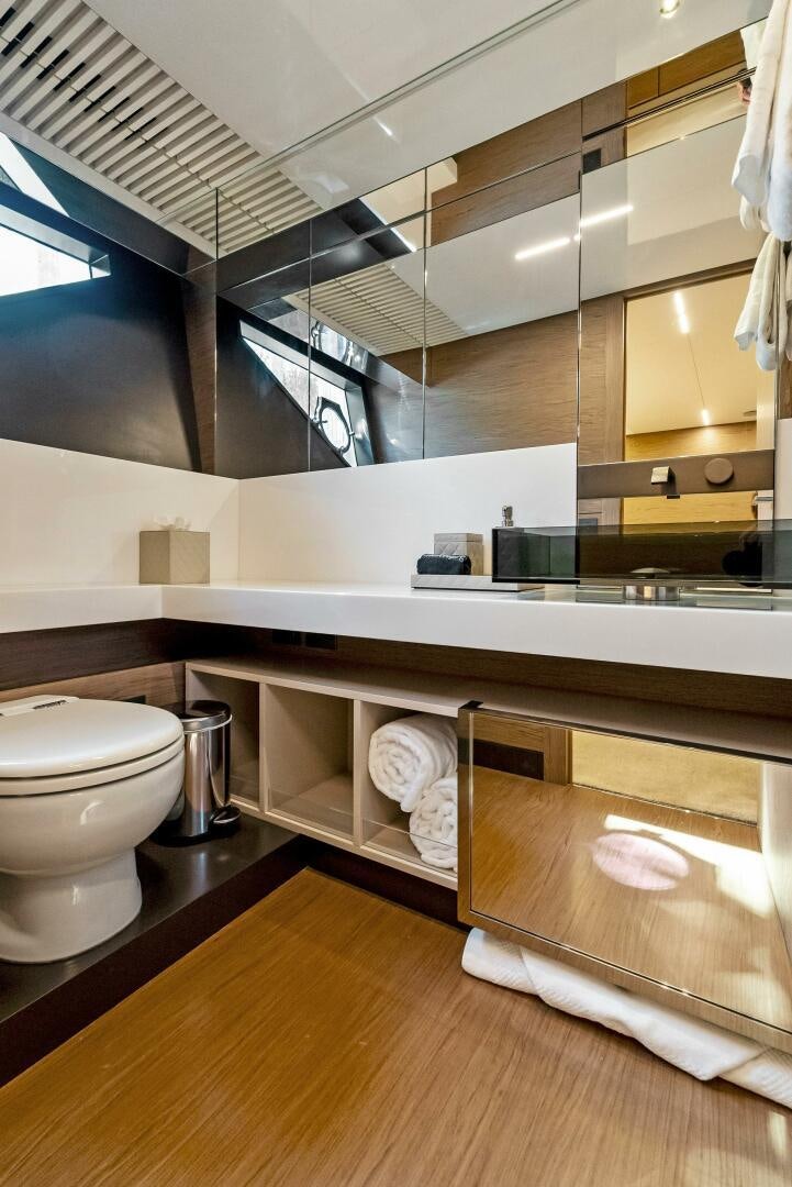 a bathroom with a toilet and sink aboard SILHOUETTE Yacht for Sale