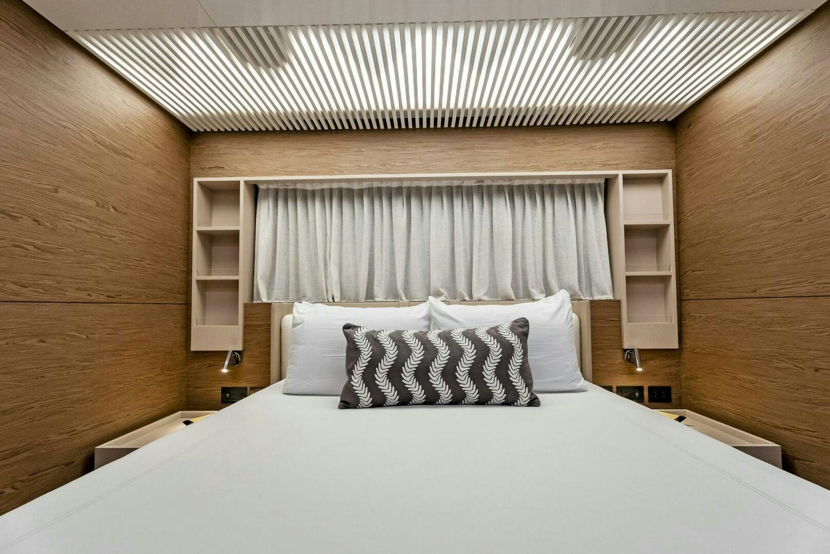 a bed with white sheets aboard SILHOUETTE Yacht for Sale